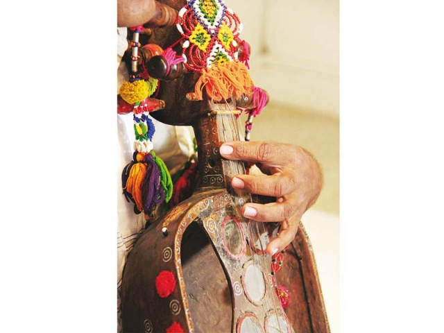 a musician from balohistan plays his sarod photo huma choudhary a musician from balohistan plays his sarod photo huma choudhary