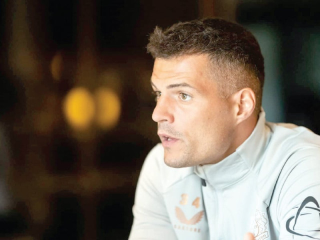 granit xhaka believes bayer leverkusen can successfully defend their bundesliga title photo afp granit xhaka believes bayer leverkusen can successfully defend their bundesliga title photo afp