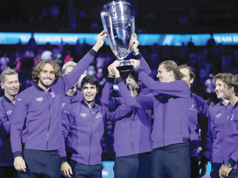 greece s stefanos tsitsipas 2l spain s carlos alcaraz 3l germany s alexander zverev 4r and other players of team europe celebrate with the trophy during the award ceremony at the end of the 2024 laver cup tennis tournament in berlin photo afp