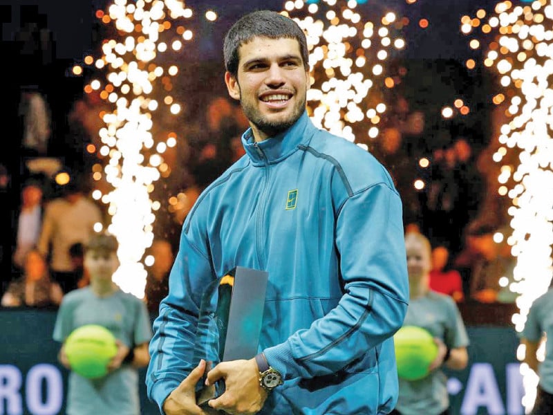 carlos alcaraz with the trophy after winning his rotterdam open final 6 4 3 6 6 2 against alex de minaur on feb 9 photo reuters