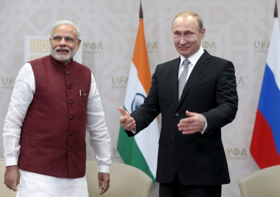 putin tells india s modi will try yoga