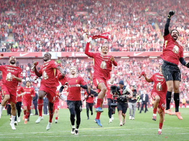 liverpool players celebrate with fans after clinching the premier league title by beating tottenham hotspur at anfield photo afp liverpool players celebrate with fans after clinching the premier league title by beating tottenham hotspur at anfield photo afp