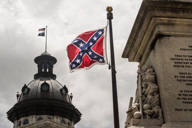 the confederate battle flag flies at the south carolina state house grounds in columbia south carolina photo afp the confederate battle flag flies at the south carolina state house grounds in columbia south carolina photo afp