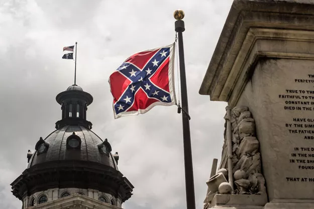 the confederate battle flag flies at the south carolina state house grounds in columbia south carolina photo afp the confederate battle flag flies at the south carolina state house grounds in columbia south carolina photo afp