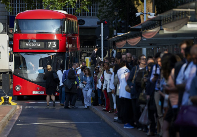 early morning commuters form queues to board buses at victoria station during a tube strike in london photo afp early morning commuters form queues to board buses at victoria station during a tube strike in london photo afp