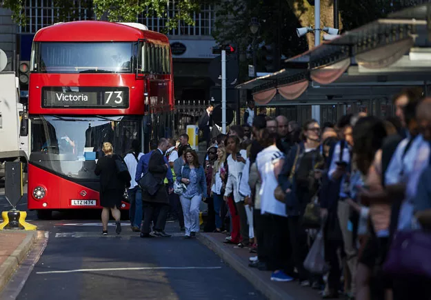 early morning commuters form queues to board buses at victoria station during a tube strike in london photo afp early morning commuters form queues to board buses at victoria station during a tube strike in london photo afp