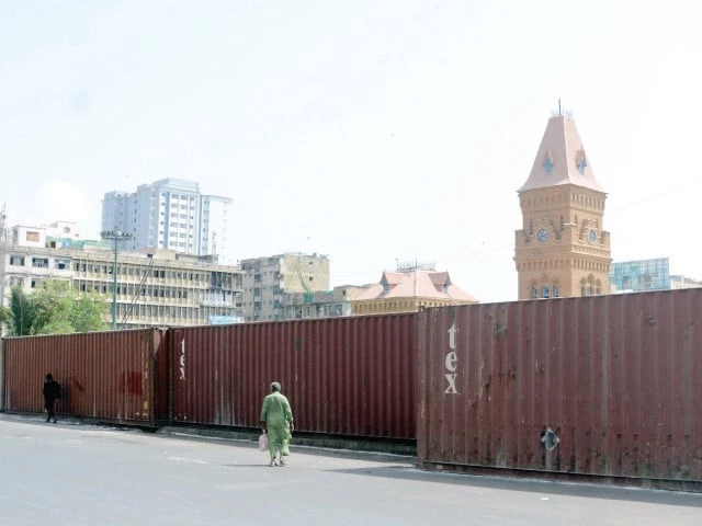 shipping containers wall off the iconic empress market turning saddar s bustle into a solemn maze as karachi prepares for main muharram processions with security not only felt but also visible under a quiet steel watch photo jalal qureshi express shipping containers wall off the iconic empress market turning saddar s bustle into a solemn maze as karachi prepares for main muharram processions with security not only felt but also visible under a quiet steel watch photo jalal qureshi express