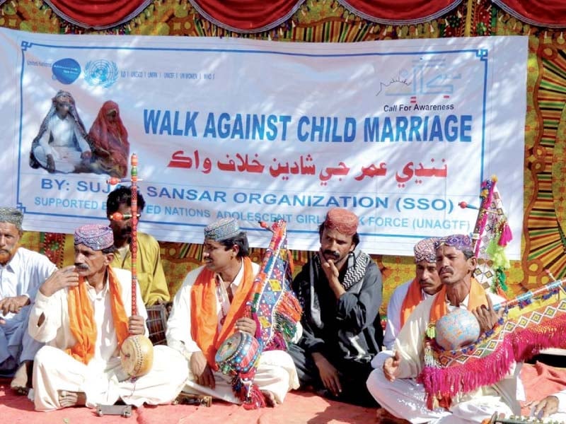 men from local community gather to raise awareness to end child marriage photo credit sso