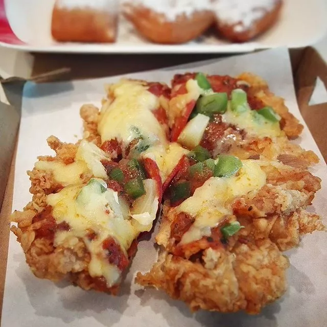 a pizza that replaces the crust with a fried chicken breast a pizza that replaces the crust with a fried chicken breast