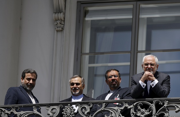 iranian foreign minister mohammad javad zarif r stands at a balcony of the palais coburg hotel where the iran nuclear talks are being held in vienna austria july 10 2015 photo reuters