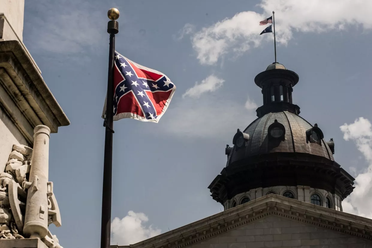the confederate battle flag flies on its last full day at the south carolina state house july 9 2015 in columbia south carolina photo afp the confederate battle flag flies on its last full day at the south carolina state house july 9 2015 in columbia south carolina photo afp
