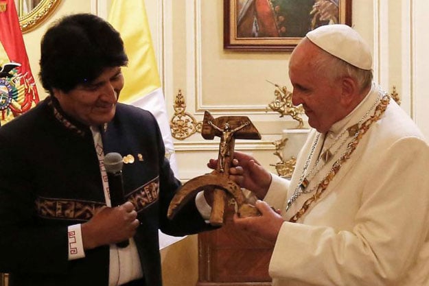 pope francis looked bemused when bolivian president evo morales left handed him the unusual gift at a meeting at quemado presidential palace photo afp