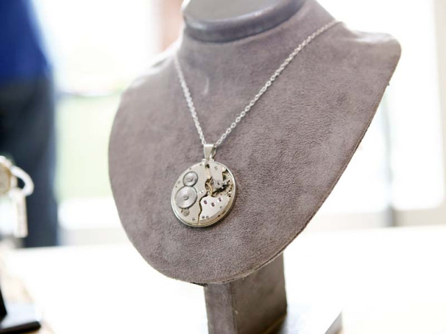the collection comprises brass silver and gold plated clock mechanisms entwined into pendants earrings cufflinks rings buttons and brooches photos publicity the collection comprises brass silver and gold plated clock mechanisms entwined into pendants earrings cufflinks rings buttons and brooches photos publicity