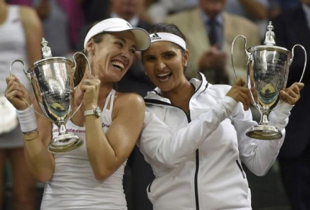 martina hingis of switzerland and sania mirza of india pose with their trophies after winning their women 039 s doubles final match against elena vesnina and ekaterina makarova of russia at the wimbledon tennis championships in london july 11 2015 photo reuters