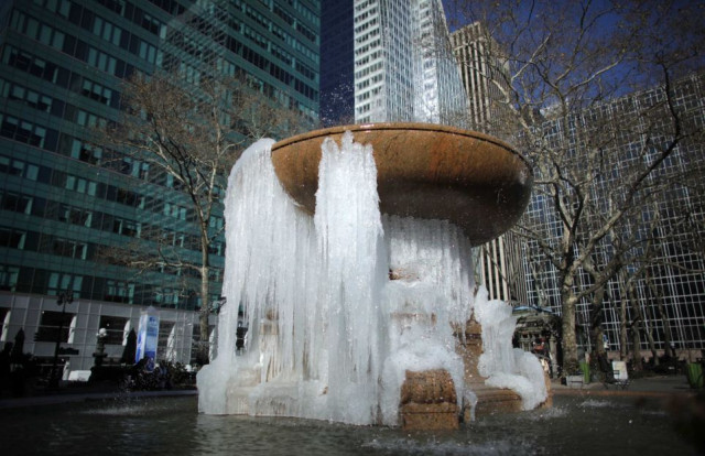 biting temperatures a fountain partially frozen into ice is seen at bryant park in new york photo reuters