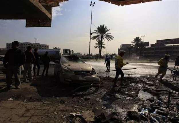 people gather at the site of car bomb attack in baghdad photo reuters people gather at the site of car bomb attack in baghdad photo reuters