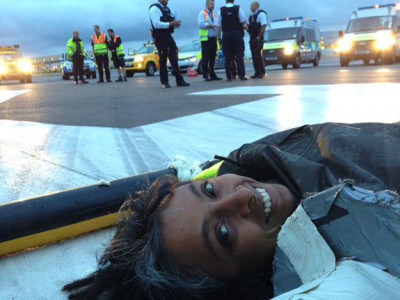 climate change activists protest on heathrow runway