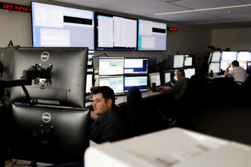 satellite controller sean sauve works at the offices of telesat a canadian satellite communications company in ottawa ontario canada march 24 2021 photo reuters