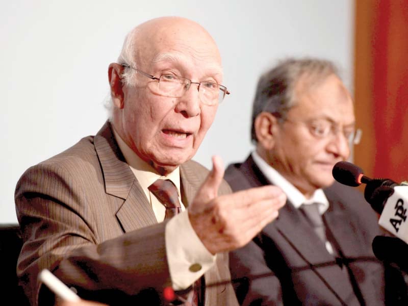 sartaj aziz briefs the media in islamabad photo afp