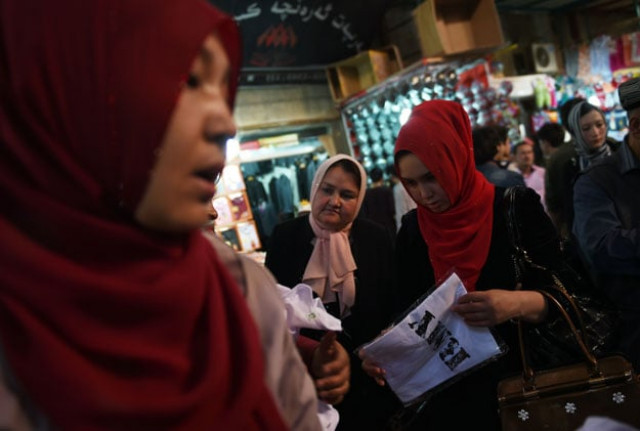 uighur women wearing headscarfs while shopping at a bazaar in hotan in china 039 s western xinjiang region photo afp uighur women wearing headscarfs while shopping at a bazaar in hotan in china 039 s western xinjiang region photo afp