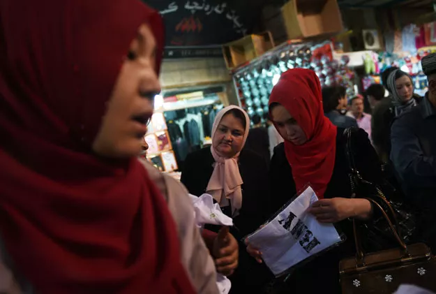 uighur women wearing headscarfs while shopping at a bazaar in hotan in china 039 s western xinjiang region photo afp uighur women wearing headscarfs while shopping at a bazaar in hotan in china 039 s western xinjiang region photo afp