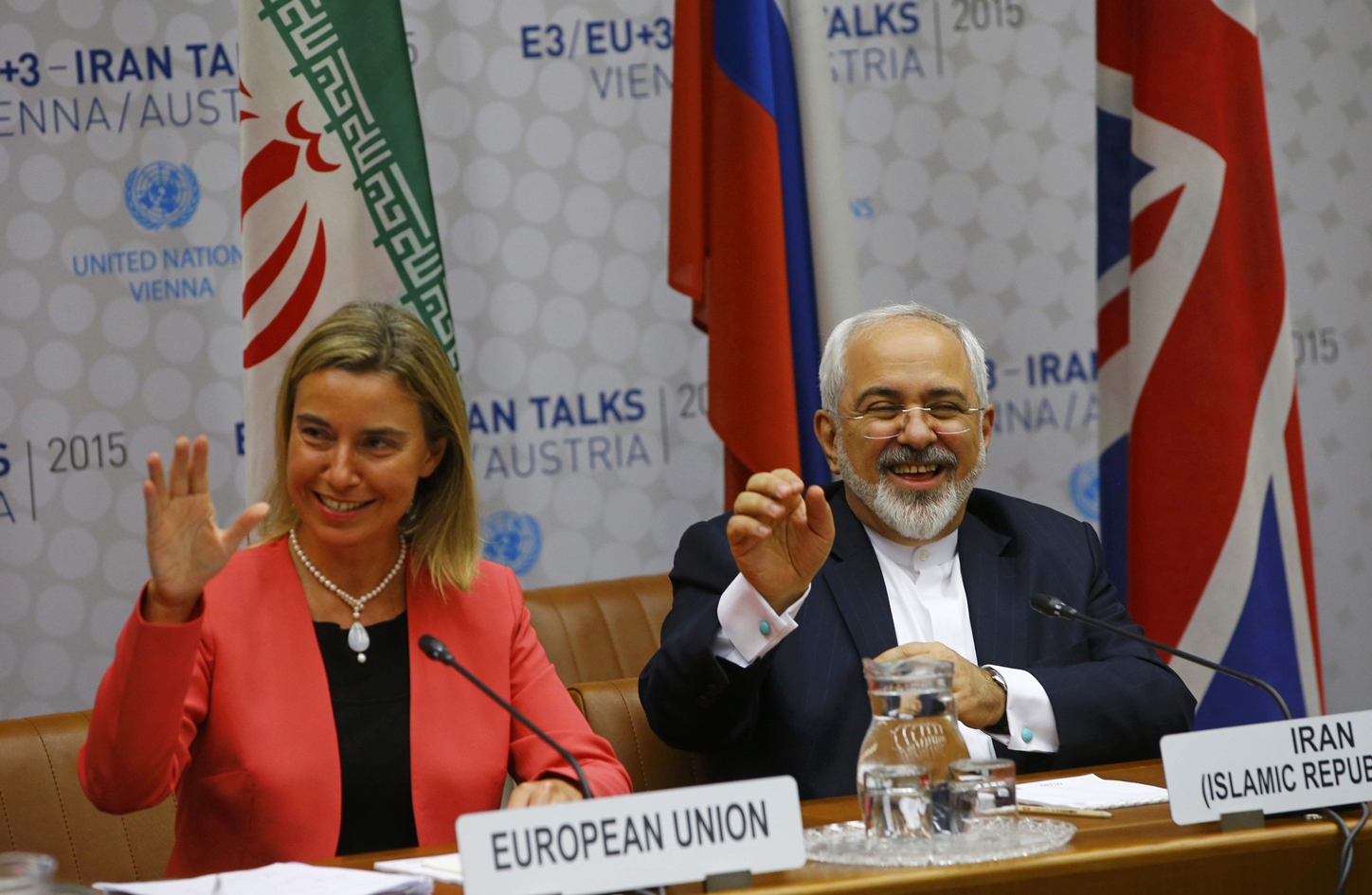 high representative of the european union for foreign affairs and security policy federica mogherini and iranian foreign minister mohammad javad zarif r react during a plenary session at the united nations building in vienna austria july 14 2015 photo afp