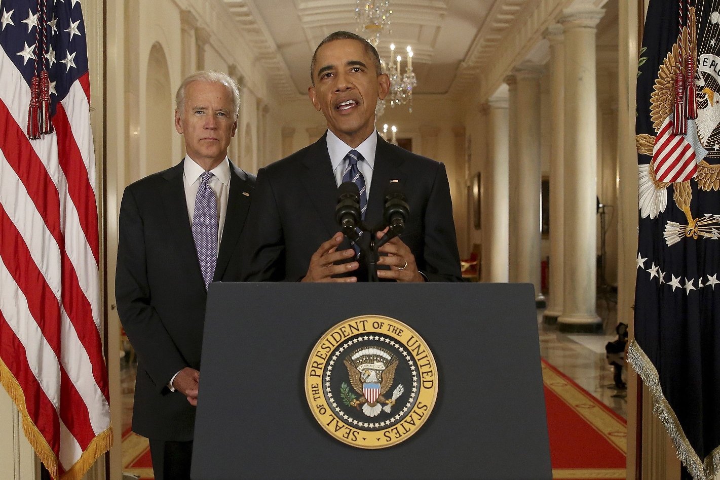 us president barack obama standing with vice president joe biden delivers remarks on in the east room of the white house in washington july 14 2015 after an iran nuclear deal is reached photo afp