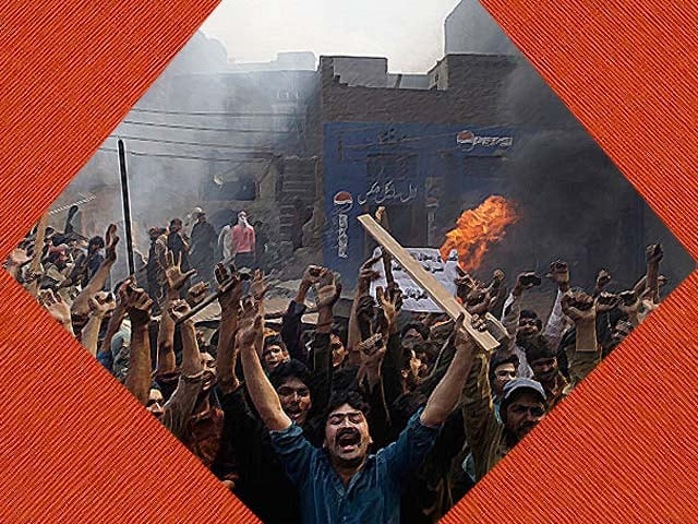 an angry mob reacts after burning christian houses in lahore photo afp