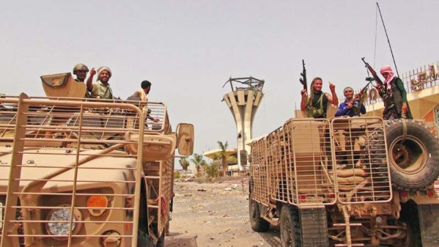 southern resistance fighters ride armoured personnel carriers at the international airport of yemen s southern port city of aden photo reuters southern resistance fighters ride armoured personnel carriers at the international airport of yemen s southern port city of aden photo reuters
