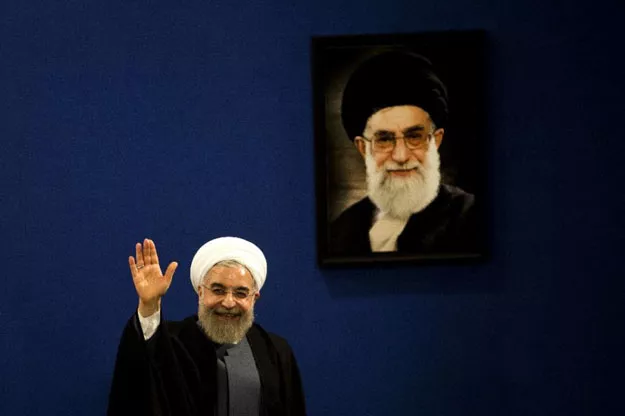iranian president hassan rouhani waves to journalists next to a portrait of supreme leader ayatollah ali khamenei at the end of a press conference in tehran on june 13 2015 photo afp iranian president hassan rouhani waves to journalists next to a portrait of supreme leader ayatollah ali khamenei at the end of a press conference in tehran on june 13 2015 photo afp
