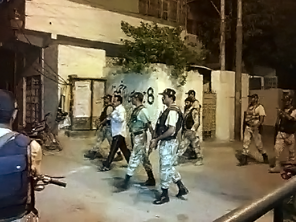 rangers take mqm leader into custody following a raid on khursheed begum memorial hall