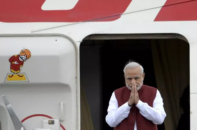 prime minister narendra modi greets welcomers upon his arrival before attending the brics and the shanghai cooperation organization sco summits in ufa russia july 8 2015 photo reuters prime minister narendra modi greets welcomers upon his arrival before attending the brics and the shanghai cooperation organization sco summits in ufa russia july 8 2015 photo reuters