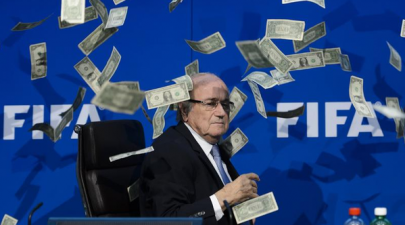 british comedian showers fifa president sepp blatter with fake money
