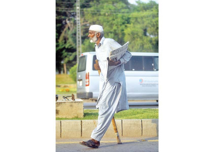 in the line of fire islamabad expressway s expansion to hurt newspaper vendor s business