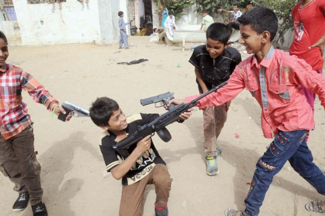 an influx of life like toy guns has increased their use among children who were seen playing target killers and kidnappers during eid holidays photo mohammad noman express an influx of life like toy guns has increased their use among children who were seen playing target killers and kidnappers during eid holidays photo mohammad noman express