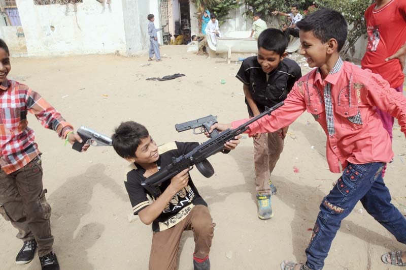 an influx of life like toy guns has increased their use among children who were seen playing target killers and kidnappers during eid holidays photo mohammad noman express