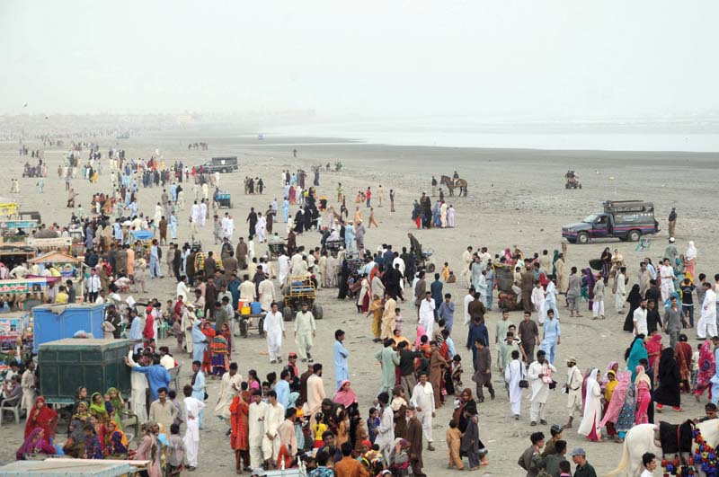 police vans and cbc lifeguards were stationed along sea view beach in clifton during the eid holidays to enforce the ban on swimming in the ocean the rough seas claimed over 40 lives during eid last year photo mohammad noman express