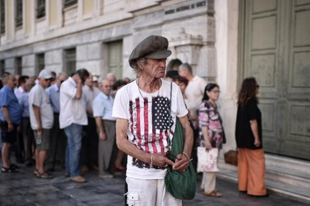 customers queued up as bank branches opened for the first time in three weeks on monday photo afp customers queued up as bank branches opened for the first time in three weeks on monday photo afp