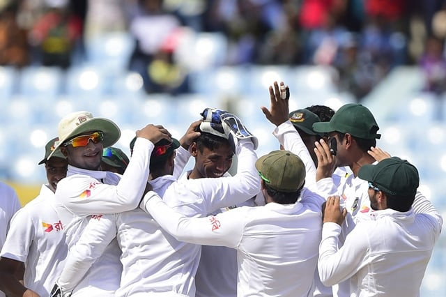 bangladesh cricketers congratulate teamate mustafizur rahman c for the dismissal of south african cricketer jean paul duminy during the first day of the first test match between bangladesh and south africa photo afp bangladesh cricketers congratulate teamate mustafizur rahman c for the dismissal of south african cricketer jean paul duminy during the first day of the first test match between bangladesh and south africa photo afp
