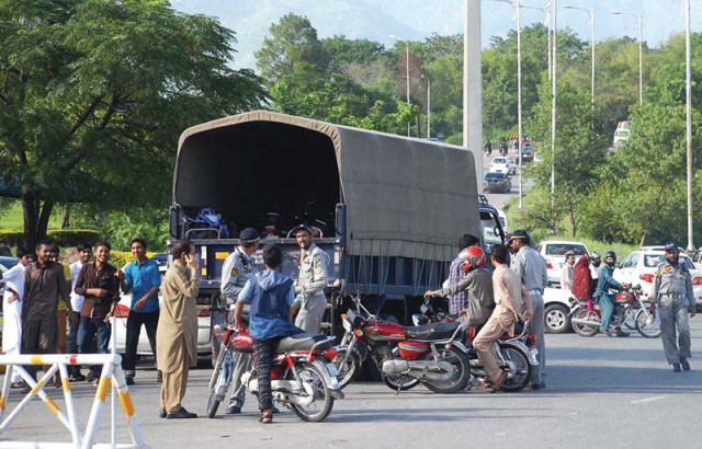 policemen taking away motorcycles at dhokri chowk photo online policemen taking away motorcycles at dhokri chowk photo online