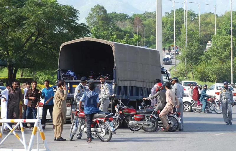 policemen taking away motorcycles at dhokri chowk photo online policemen taking away motorcycles at dhokri chowk photo online