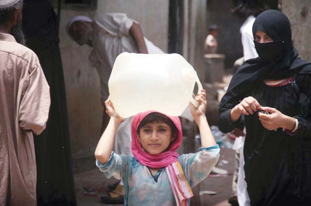 a little girl belonging to lyari carries a water container on her head as shortage of water looms large in the face of the city water crisis prevailed in karachi even during the eid holidays and has been continuing in many areas ever since photo online a little girl belonging to lyari carries a water container on her head as shortage of water looms large in the face of the city water crisis prevailed in karachi even during the eid holidays and has been continuing in many areas ever since photo online