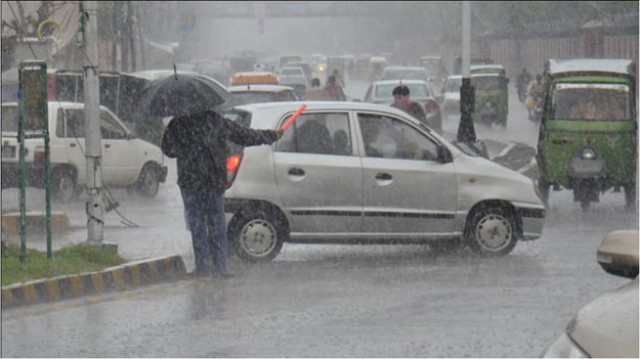 drainage of rain water from most roads completed by 5 30pm says lahore dco s public relations officer photo express
