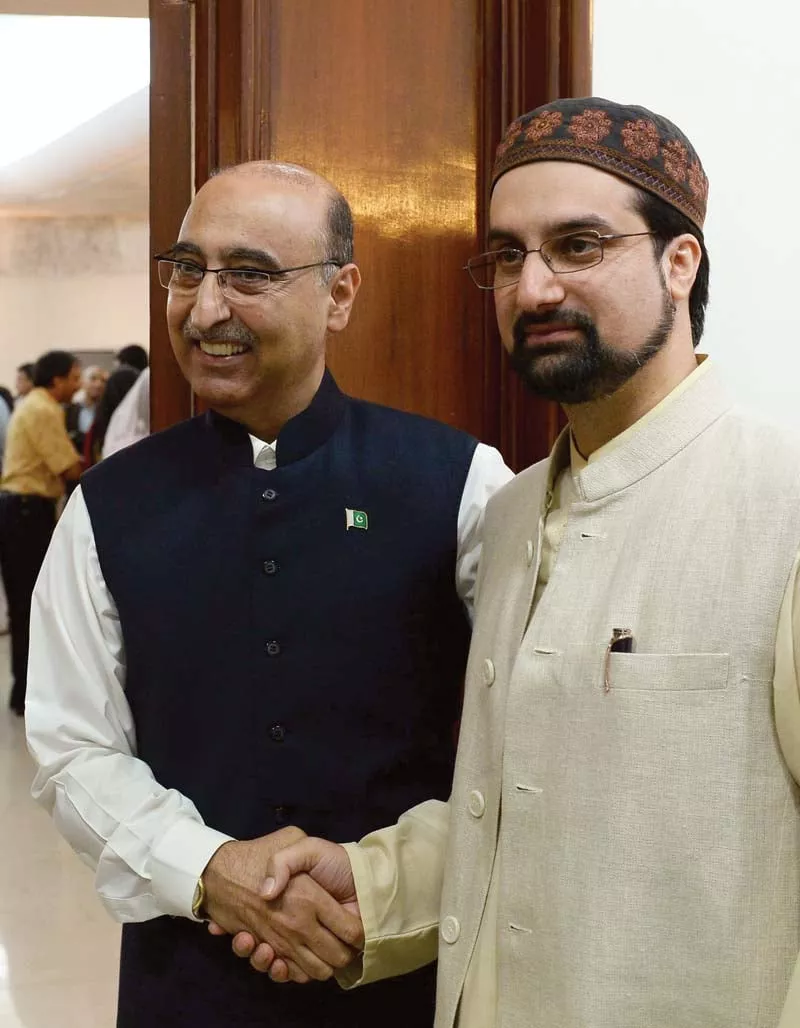 abdul basit l welcomes mirwaiz umer farooq at the eid milan party in new delhi photo afp abdul basit l welcomes mirwaiz umer farooq at the eid milan party in new delhi photo afp