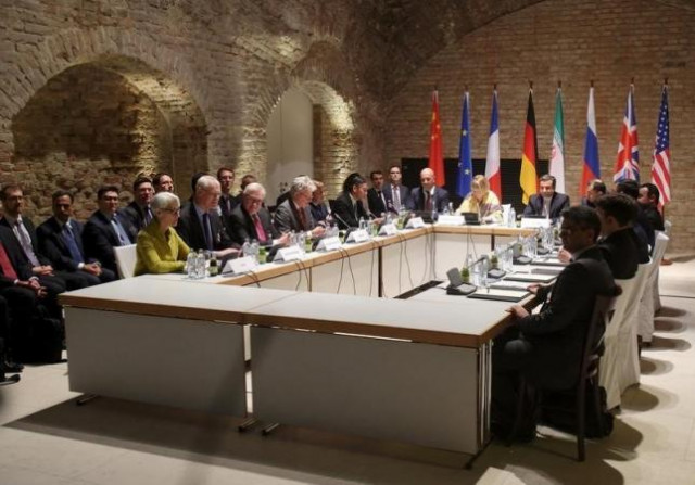 negotiators of iran and six world powers face each other at a table in the historic basement of palais coburg hotel in vienna photo reuters negotiators of iran and six world powers face each other at a table in the historic basement of palais coburg hotel in vienna photo reuters