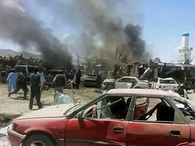 this file photo shows a suicide blast at a market in afghanistan a suicide bomb at a market in almar district of faryab province on wednesday left 19 people dead photo afp