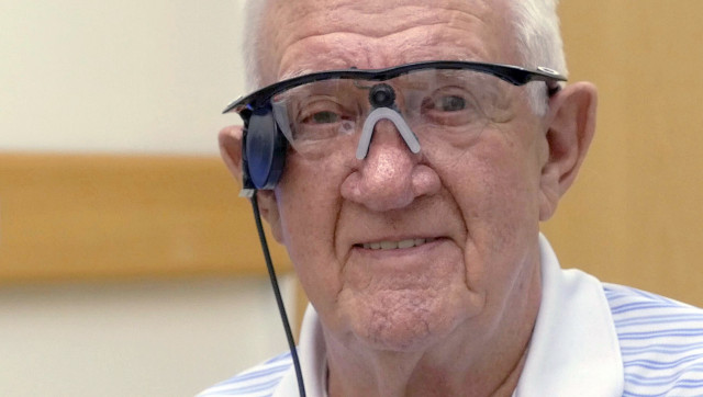 this handout picture released by the central manchester university hospitals nhs foundation trust press office on july 22 2015 shows age related macular degeneration amd sufferer ray flynn wearing a quot bionic eye quot at manchester royal eye hospital in manchester central england photo afp this handout picture released by the central manchester university hospitals nhs foundation trust press office on july 22 2015 shows age related macular degeneration amd sufferer ray flynn wearing a quot bionic eye quot at manchester royal eye hospital in manchester central england photo afp