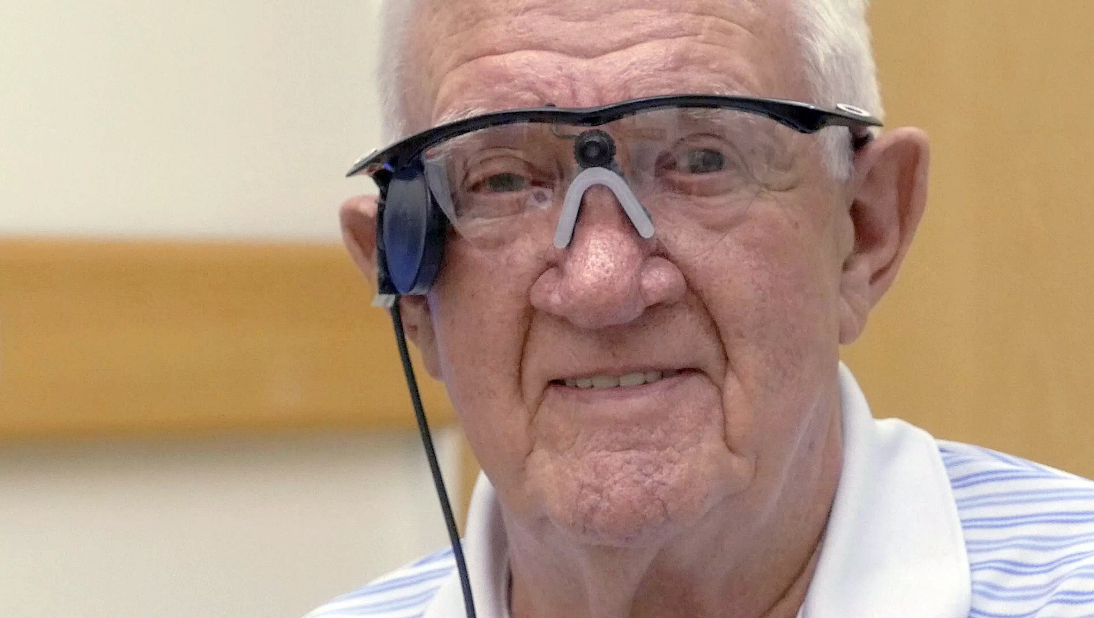 this handout picture released by the central manchester university hospitals nhs foundation trust press office on july 22 2015 shows age related macular degeneration amd sufferer ray flynn wearing a quot bionic eye quot at manchester royal eye hospital in manchester central england photo afp this handout picture released by the central manchester university hospitals nhs foundation trust press office on july 22 2015 shows age related macular degeneration amd sufferer ray flynn wearing a quot bionic eye quot at manchester royal eye hospital in manchester central england photo afp