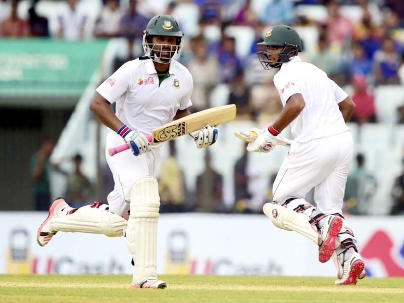 tamim and mahmudullah pegged the tourists back with a watchful third wicket stand of 89 that ended when the former was bowled out by part time spinner dean elgar photo afp