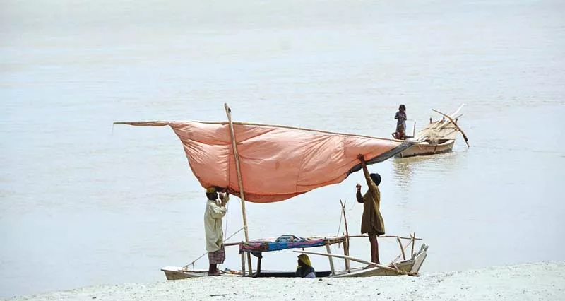 people park their boats on the right bank of river indus near aqil village in larkana after the flood warning was issued photo app people park their boats on the right bank of river indus near aqil village in larkana after the flood warning was issued photo app